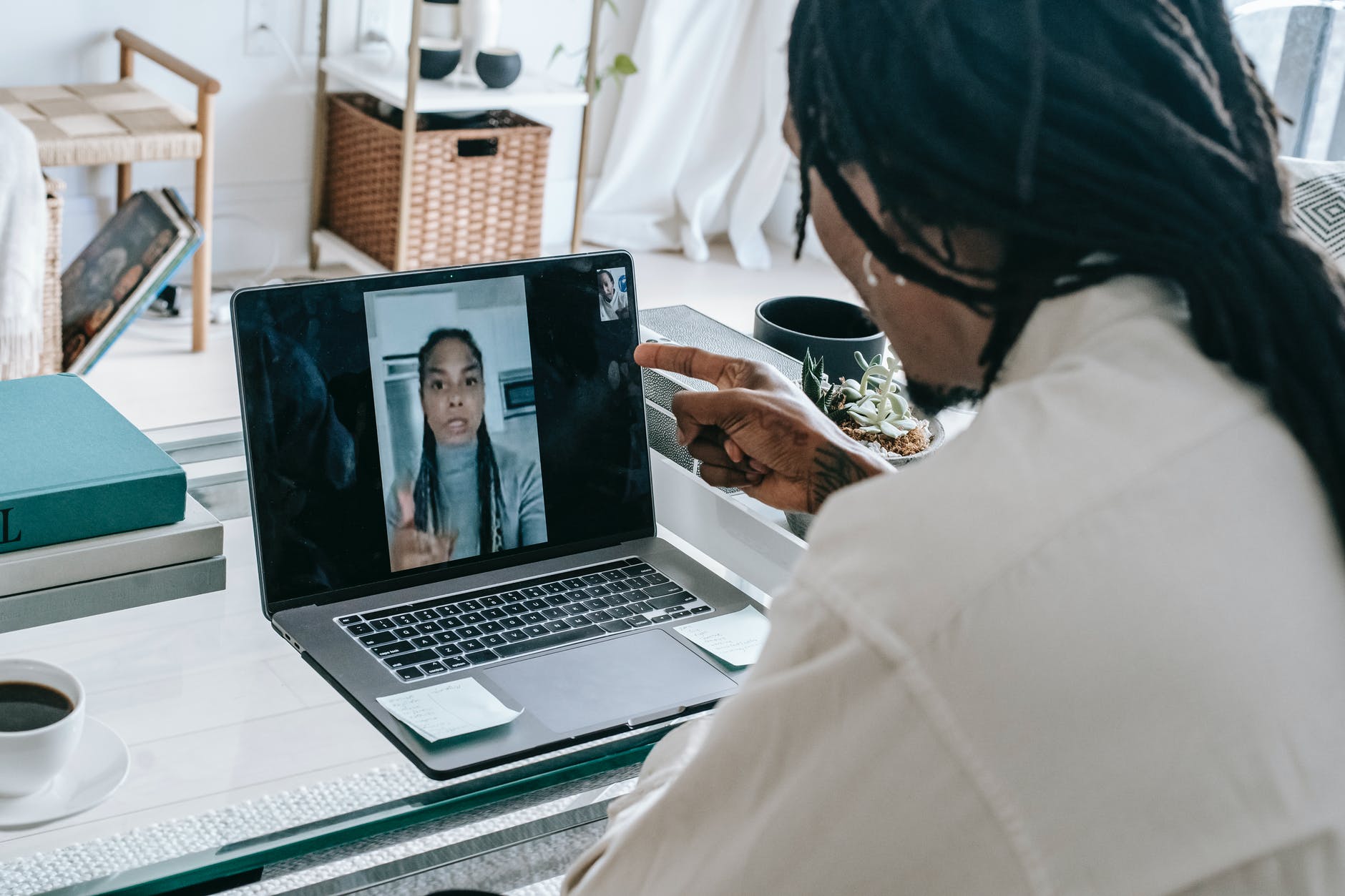 stressed black couple having video call via laptop