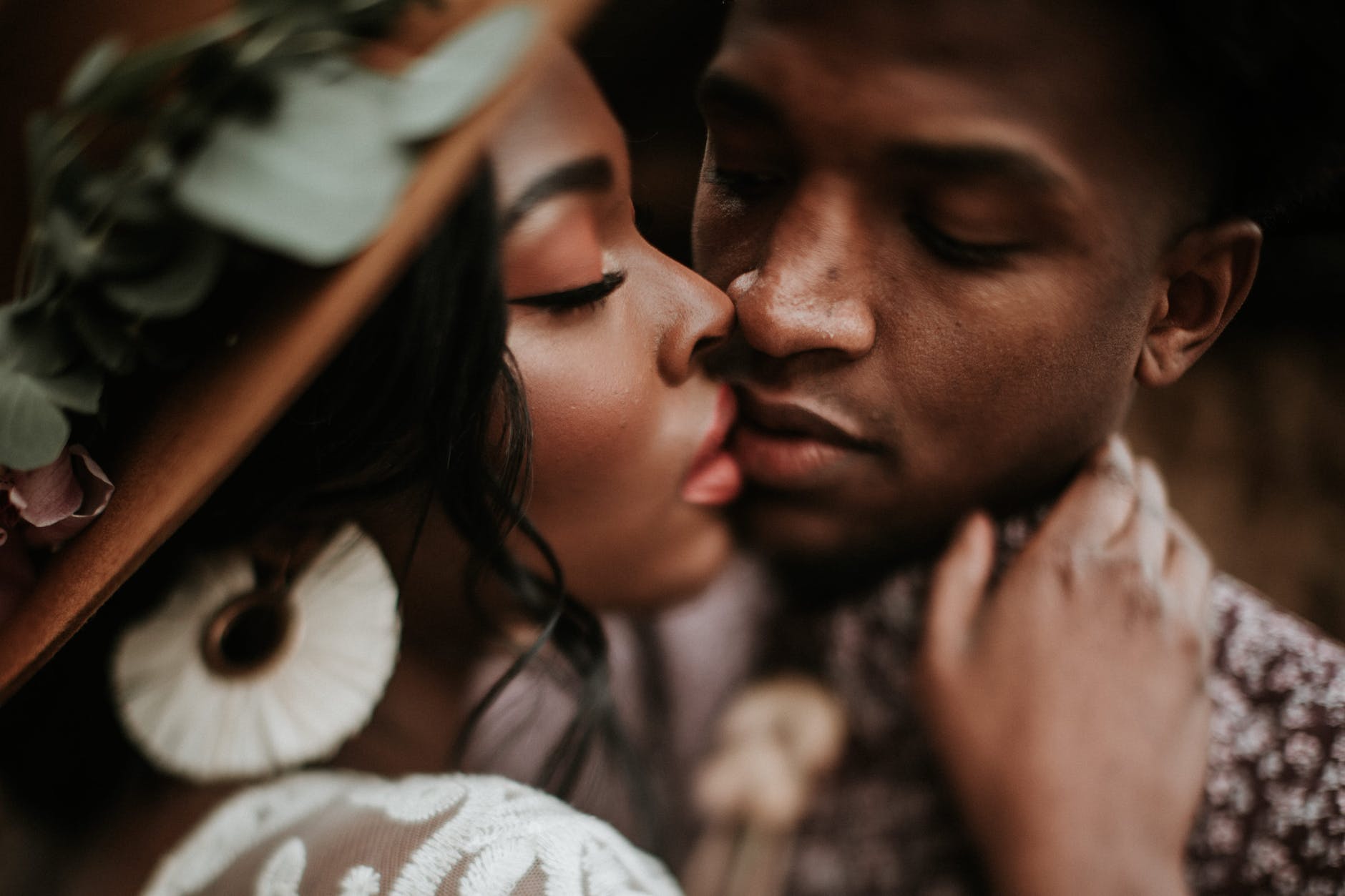 close up photo of man kissing woman