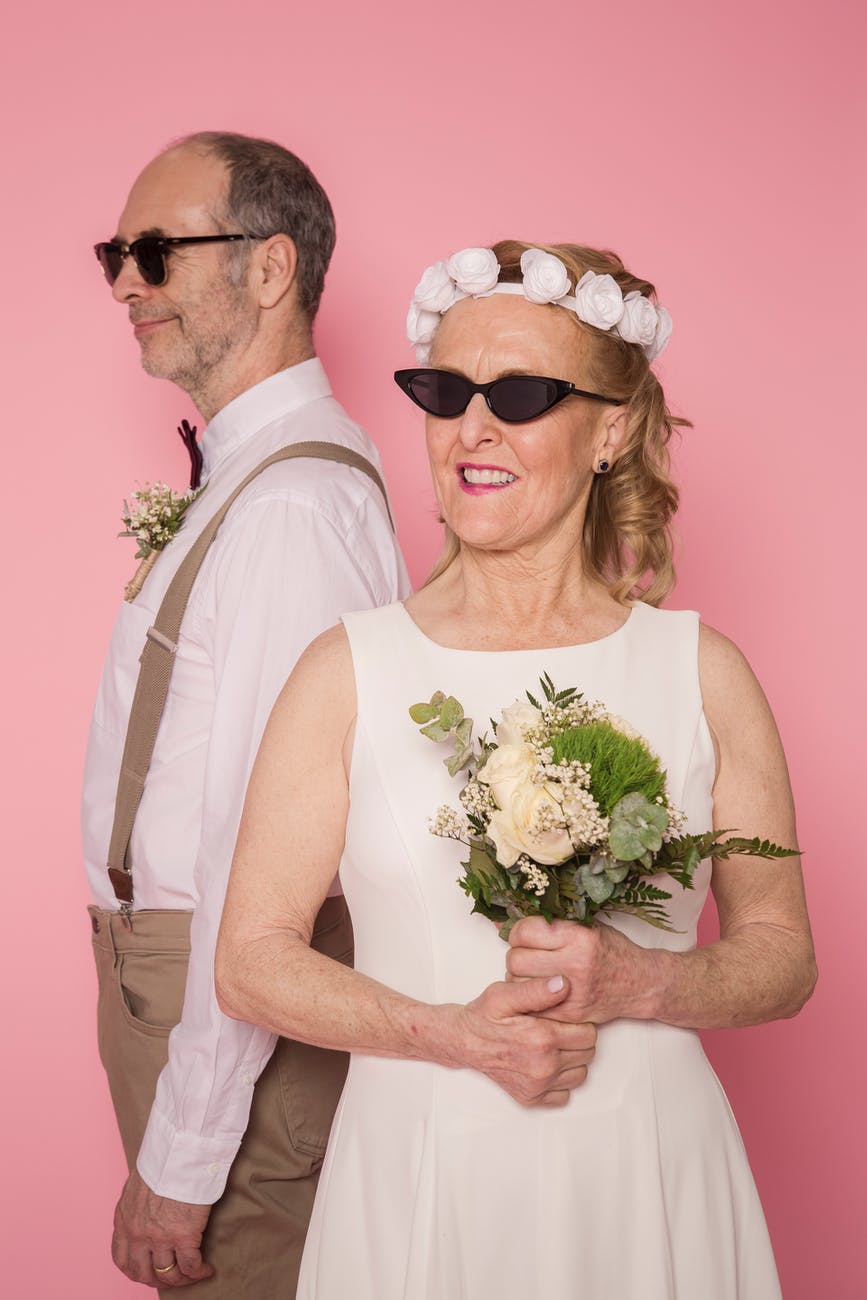 elderly couple wearing sunglasses